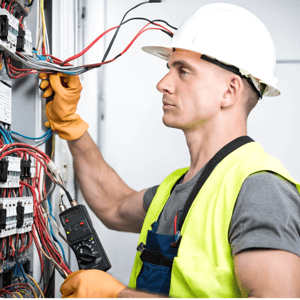 electrician working n fuse board