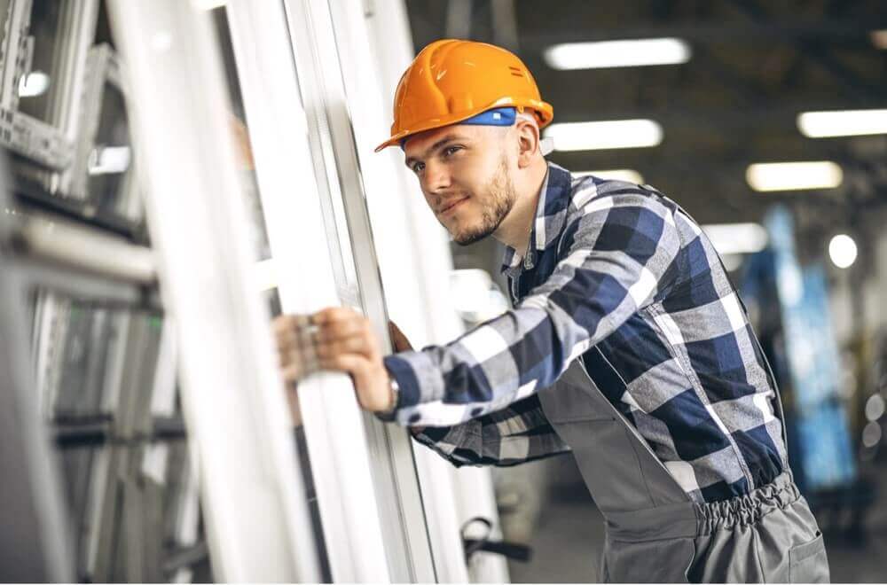 Man selecting upvc window frames