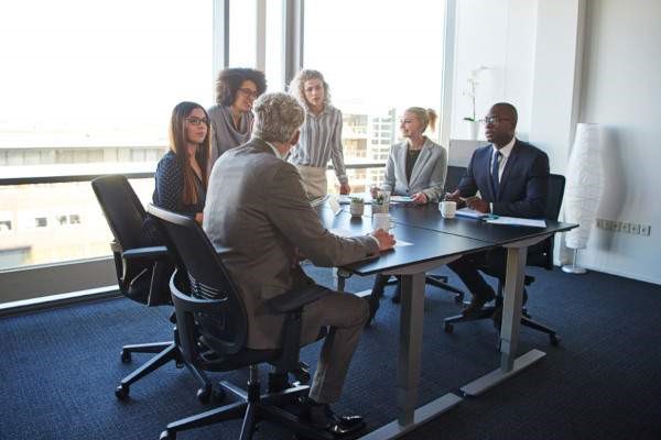 Team having meeting in board room